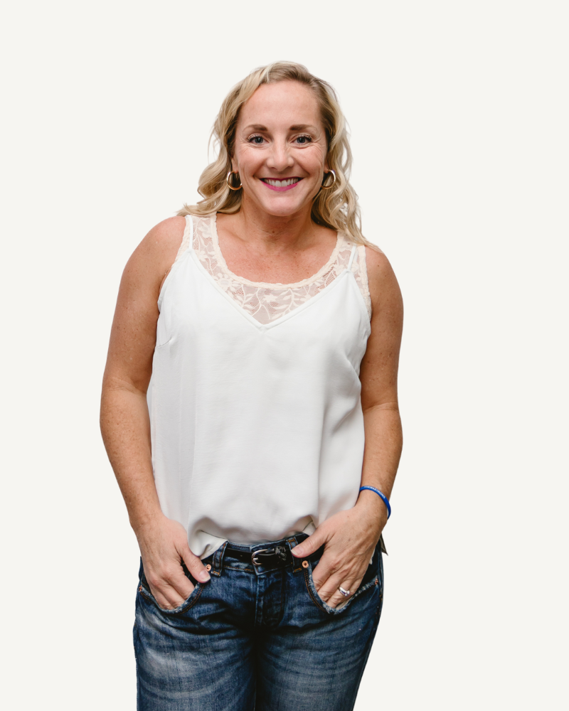 A woman wearing a Full Lace Tank crop top and jeans, showcasing a trendy and casual outfit.
