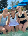 3 girls in a pool wearing halftee swimtee