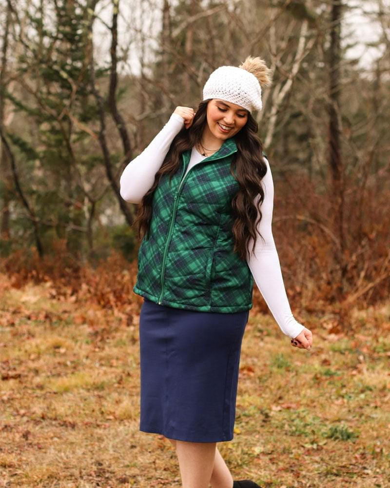 Woman in plaid vest and hat, Crew Neck Long Sleeve.