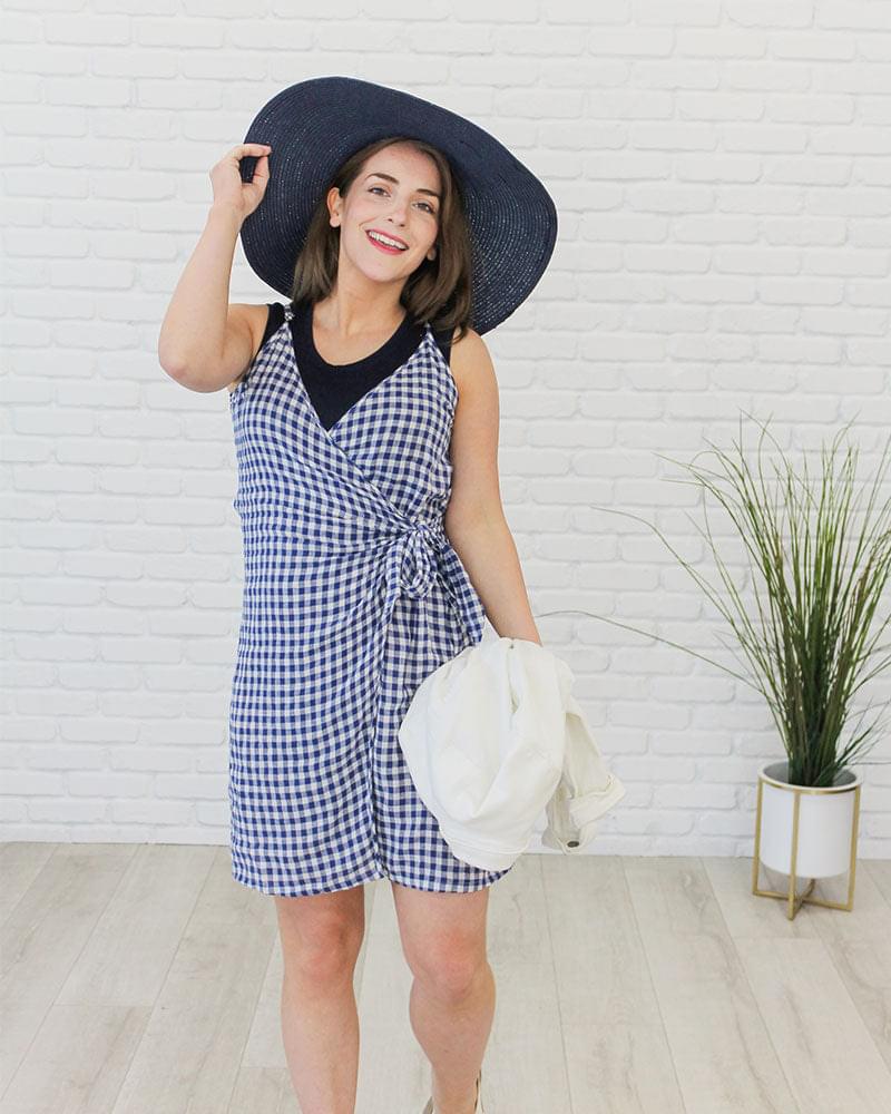 Woman in blue & white checkered dress & hat, wearing Crew Neck Tank Halftee.
