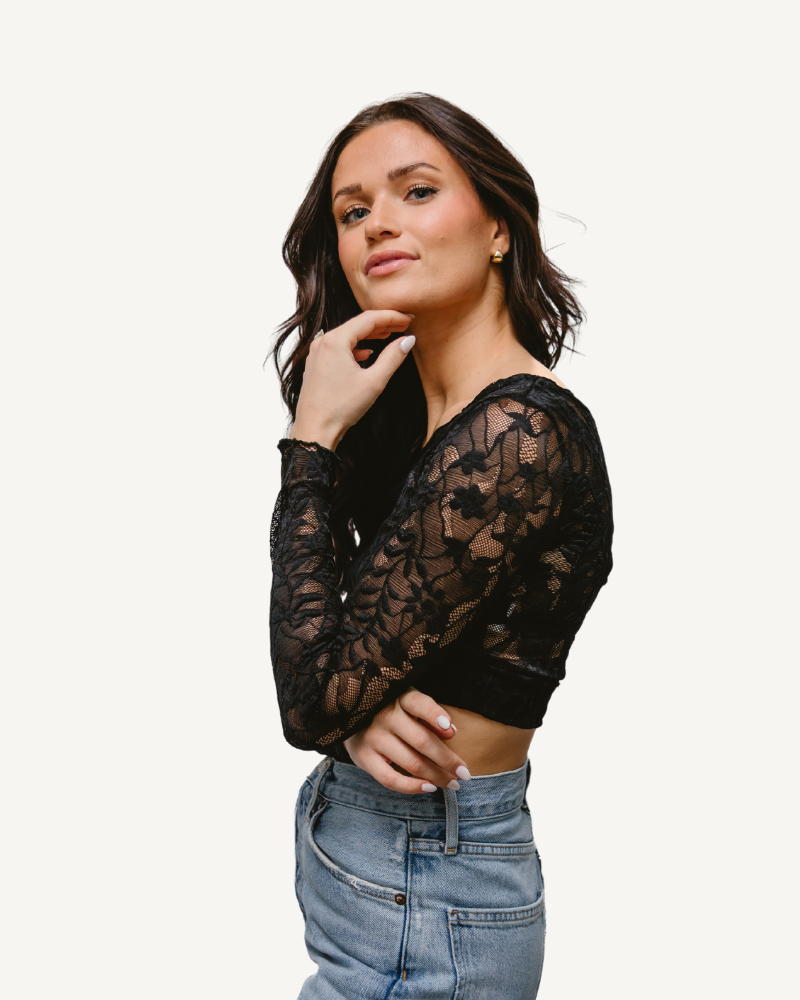 A woman wearing a Full Lace Tank crop top and jeans, showcasing a trendy and casual outfit.