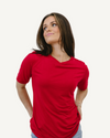  Woman in red shirt and jeans, standing confidently. Favorite Tee.