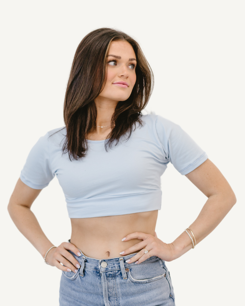 Woman in gray crop top and jeans. Discontinued Basic Cap Sleeve.