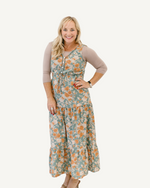 A beautiful teal maxi dress with floral designs