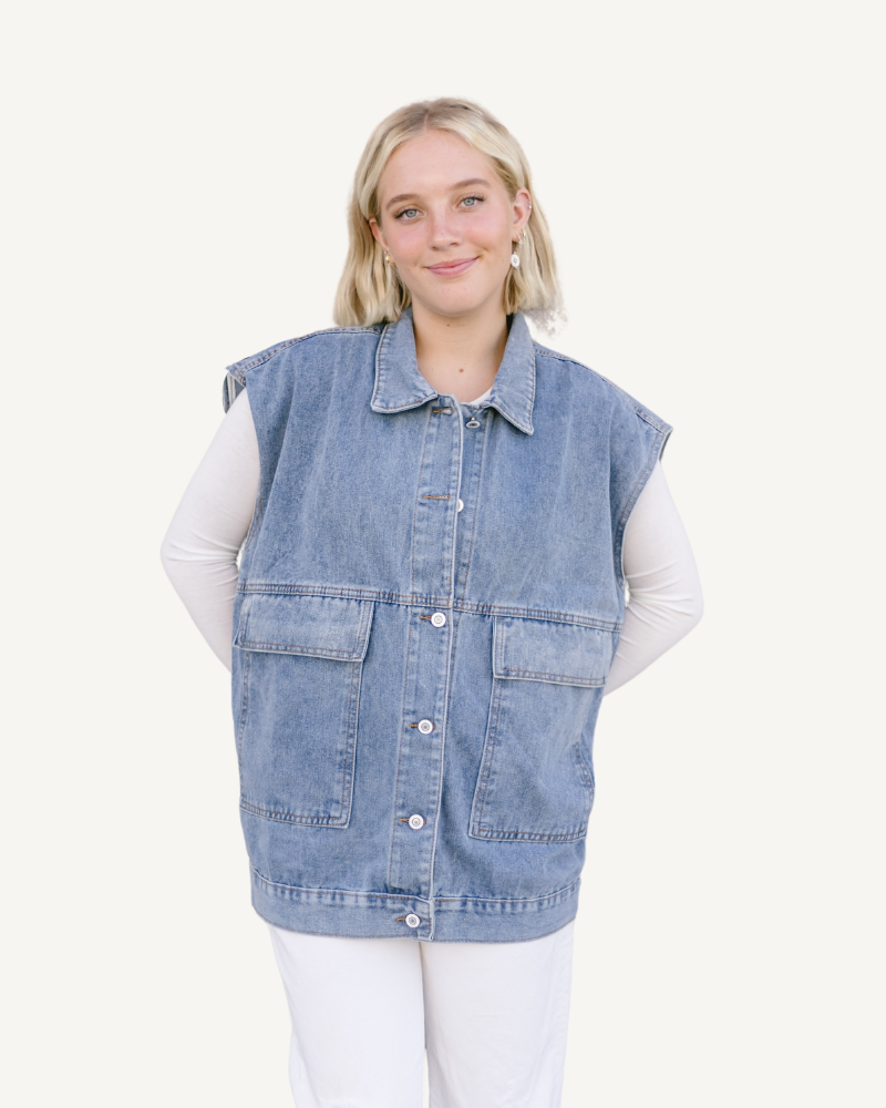 Denim Button Up Vest: A denim vest made from denim fabric, featuring buttons for closure.