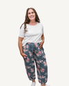 A woman wearing floral print pants.