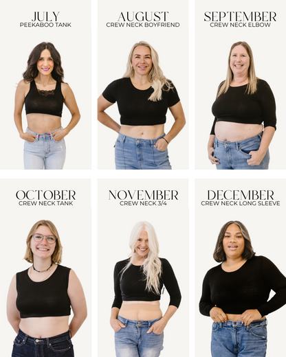 A diverse group of women in fresh blackshirts and jeans posing for a photo.