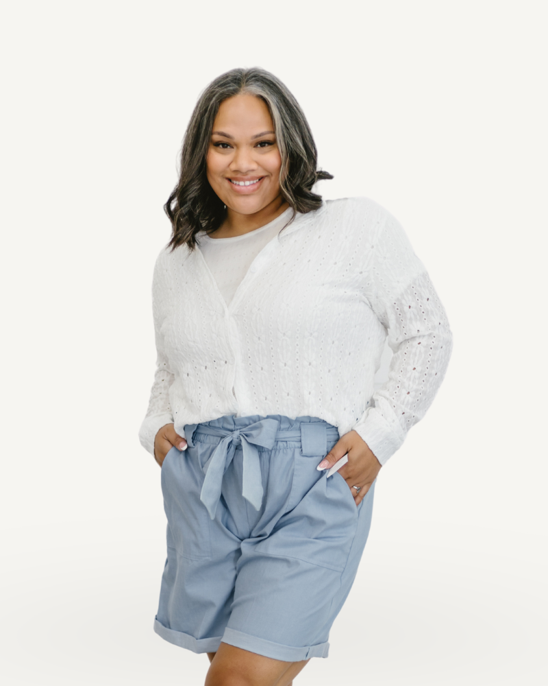 girl wearing white long sleeve and short jeans