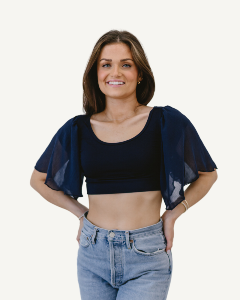 The model wears a Waterfall Sleeved Halftee, a crop top with jeans, showcasing a trendy and stylish outfit.
