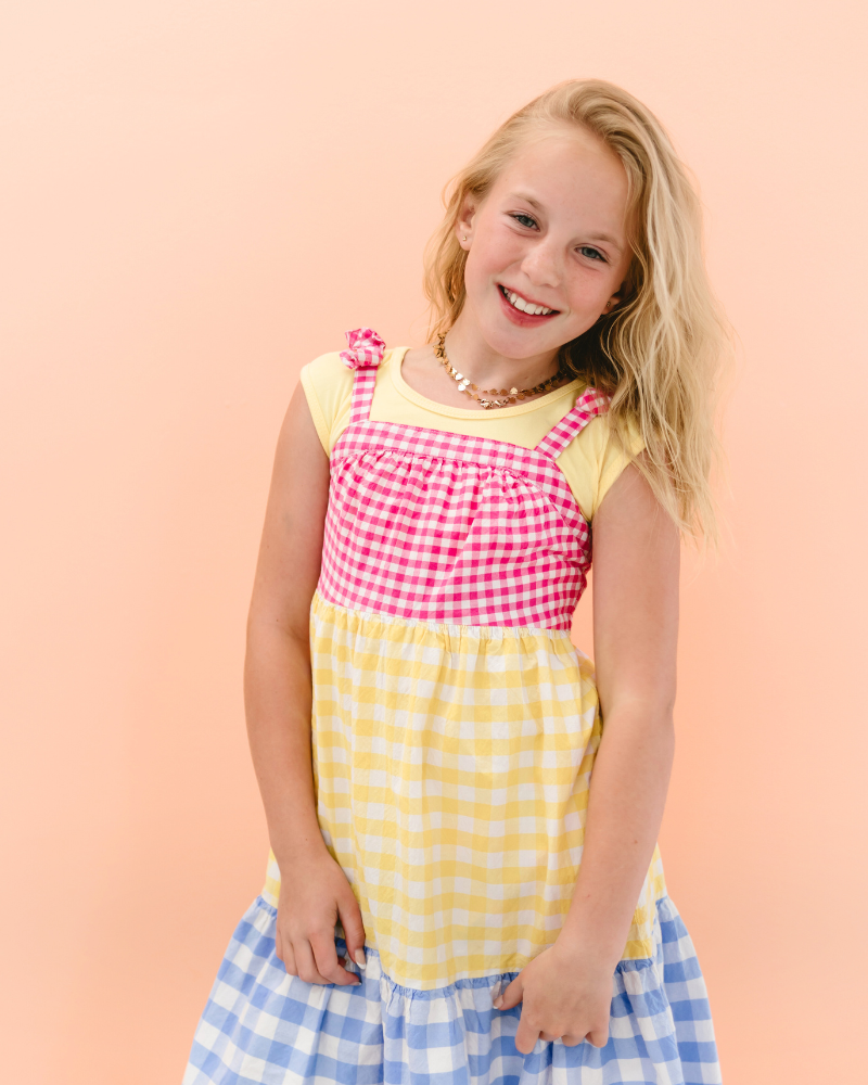 Young girl in yellow and white cat print dress, Girlee Basic Cap Sleeve.