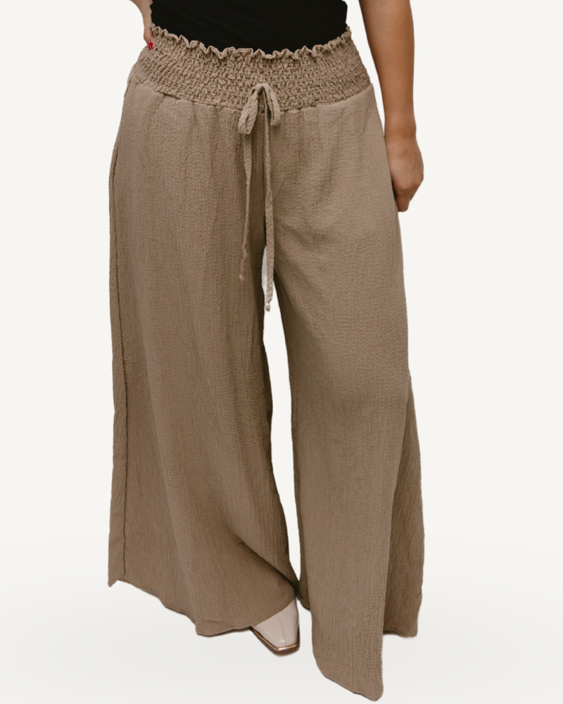 Wide leg linen pants with pockets, part of the Solid French Terry Wide Leg Jumpsuit.