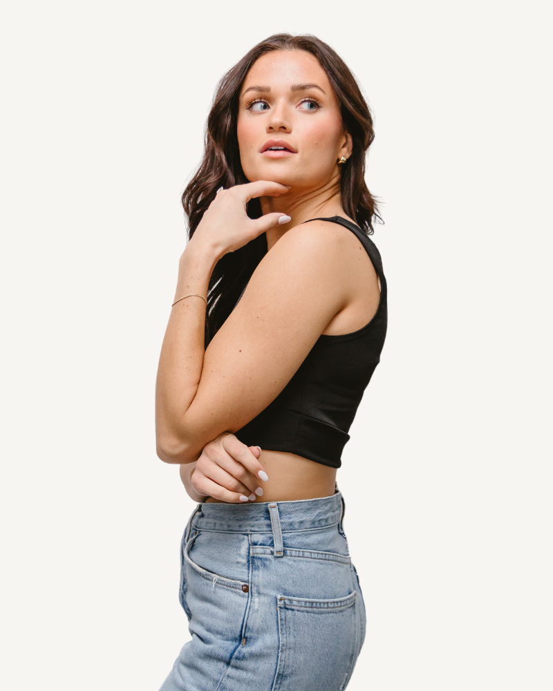 A woman in an Elegant Tank wearing a crop top with the words "double layered machine" written on it.