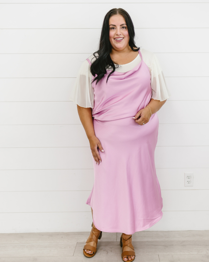 Plus size coral floral top with waterfall sleeves, perfect for any occasion.