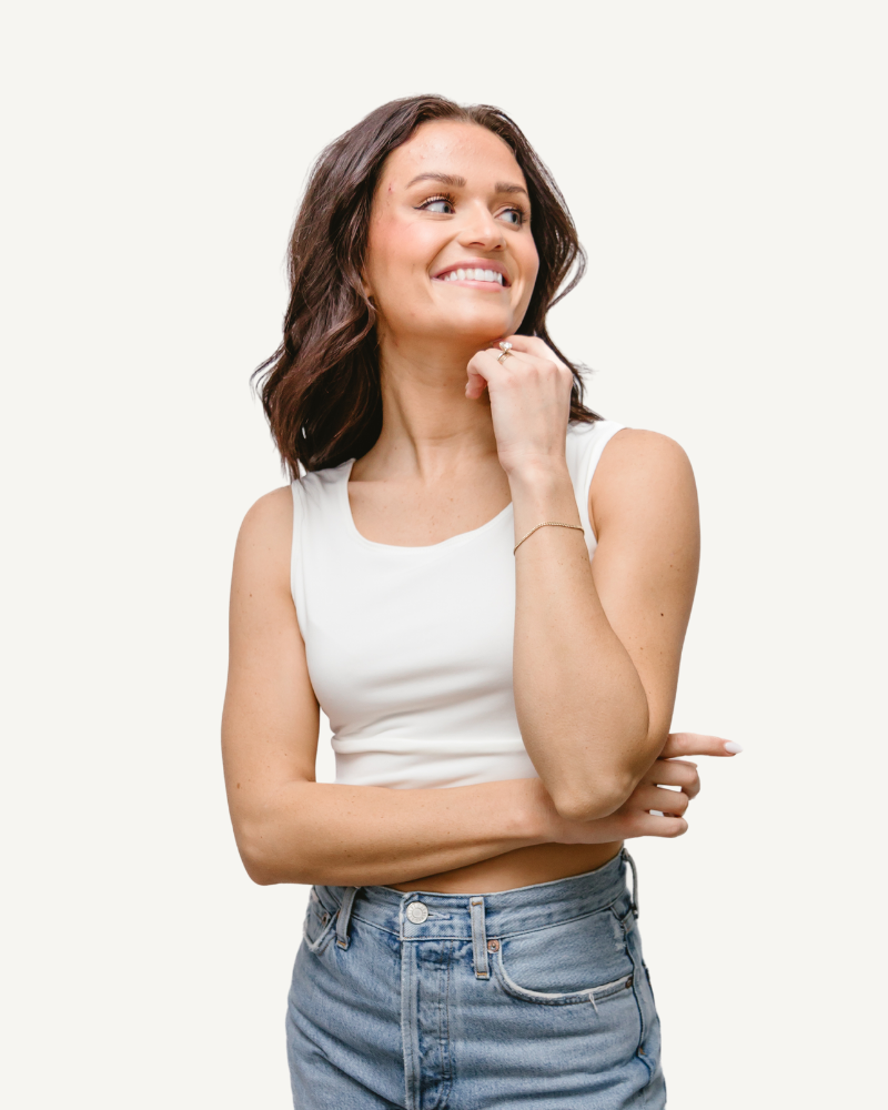 A woman wearing an Elegant Tank, seen from the back, in a white crop top.