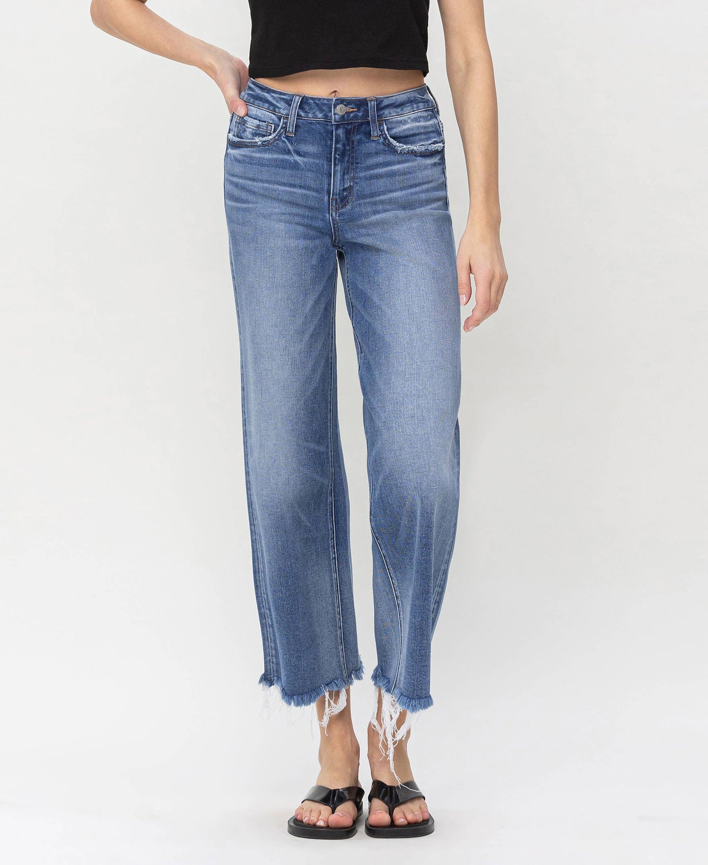 Denim high rise jeans featuring frayed edges, perfect for layering with HALFTEE Layering Fashions.