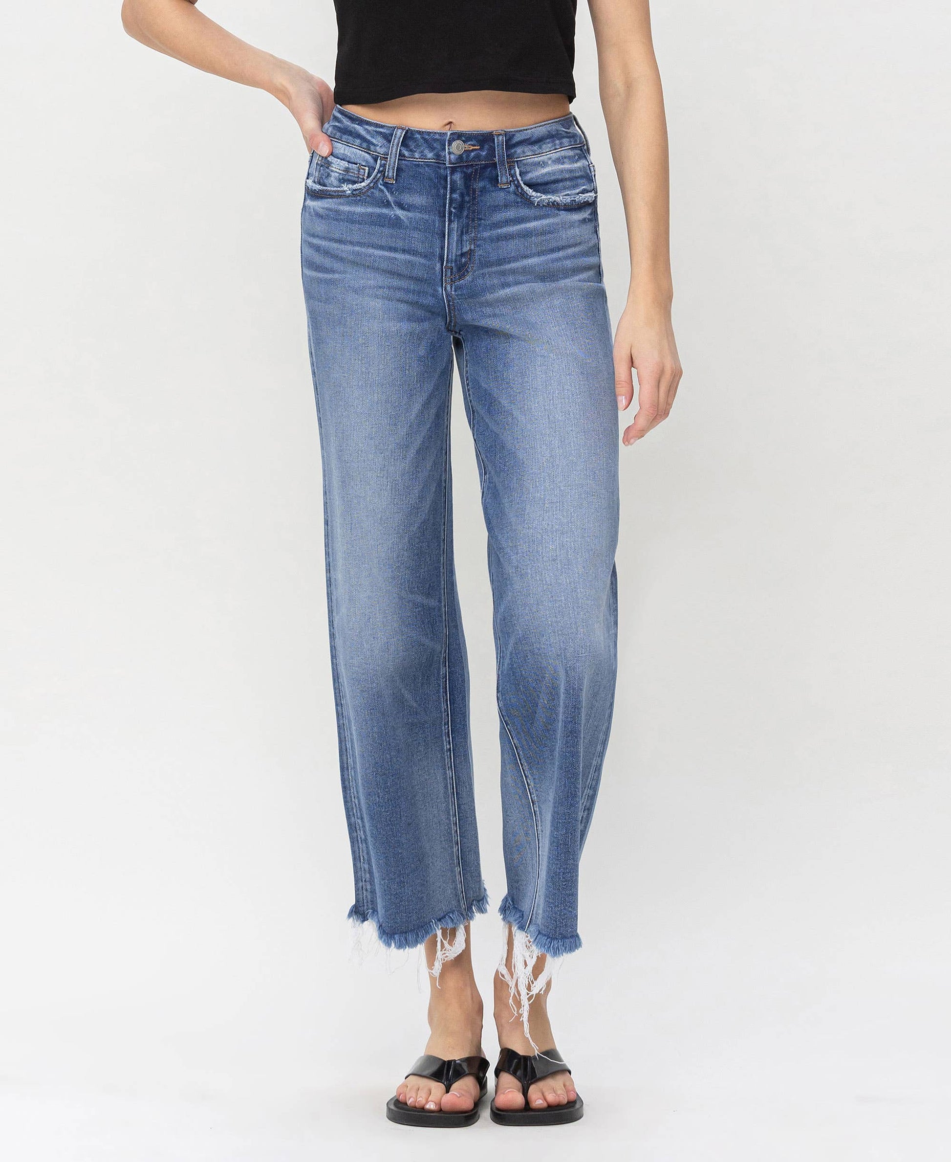 Denim high rise jeans featuring frayed edges, perfect for layering with HALFTEE Layering Fashions.