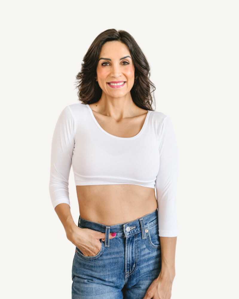 A girl wearing 3/4 crop white top with jeans