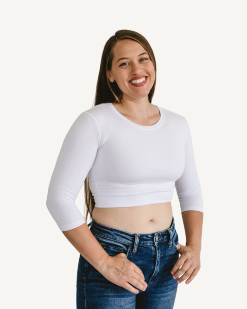 A woman in a white crop top and jeans, wearing a Crew Neck 3/4 Sleeve Halftee.