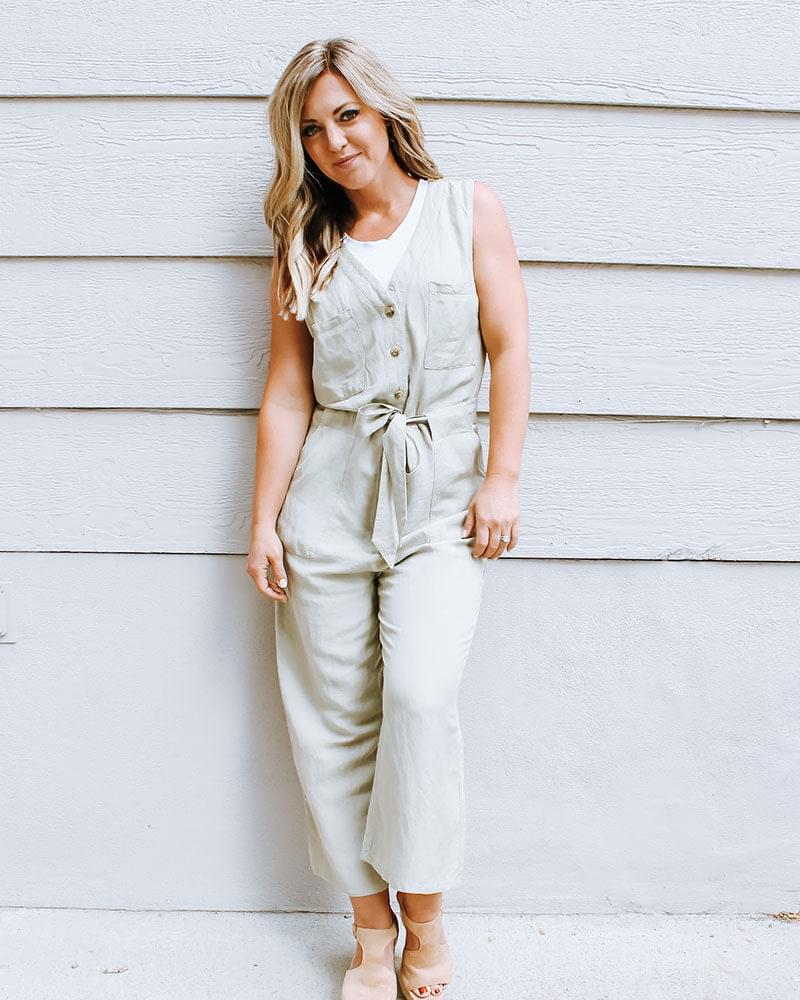 A sage jumpsuit with a crew neck tank halftee.