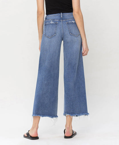Stylish high rise jeans made from denim with frayed edges, ideal for layering by HALFTEE Layering Fashions.