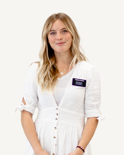 A woman in a white dress wearing a purple badge, promoting the 'Build Your Own Missionary Bundle'.