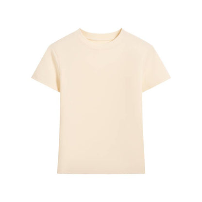 Plain beige t-shirt with short sleeves and a round neckline, set against a white background. The shirt appears soft and minimalistic.