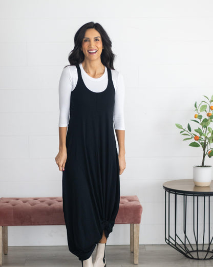 A woman in a blue crop top and jeans, wearing a Crew with balck dress Neck 3/4 Sleeve Halftee.