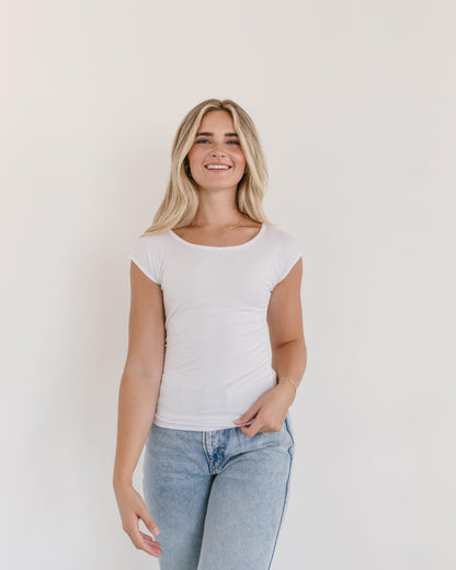 A model in a white t-shirt and jeans, showcasing a Basic Cap Sleeve Full-Length outfit.