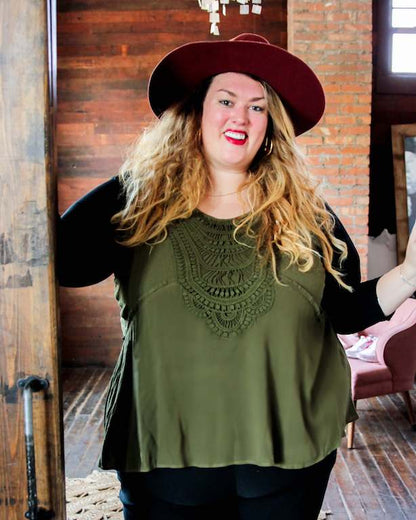 Woman in black top and hat, wearing Classic Three Fourth Sleeve Halftee Black.