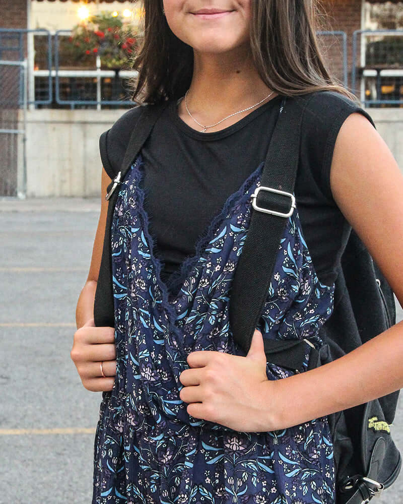 Young girl in black and white cat print dress, Girlee Basic Cap Sleeve.