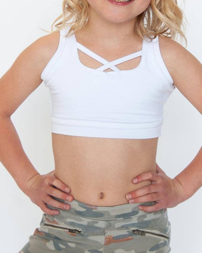 A young girl wearing a white sports bra top from GIRLEE Criss-Cross Tank collection.