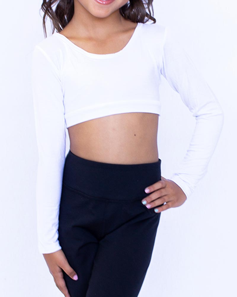 A young girl wearing a GIRLEE Long-Sleeve white crop top and black pants.