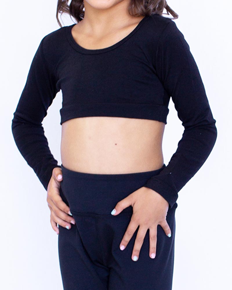 A young girl wearing a GIRLEE Long-Sleeve black crop top and black pants.