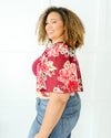 Plus size coral  ref floral top with waterfall sleeves, perfect for any occasion.