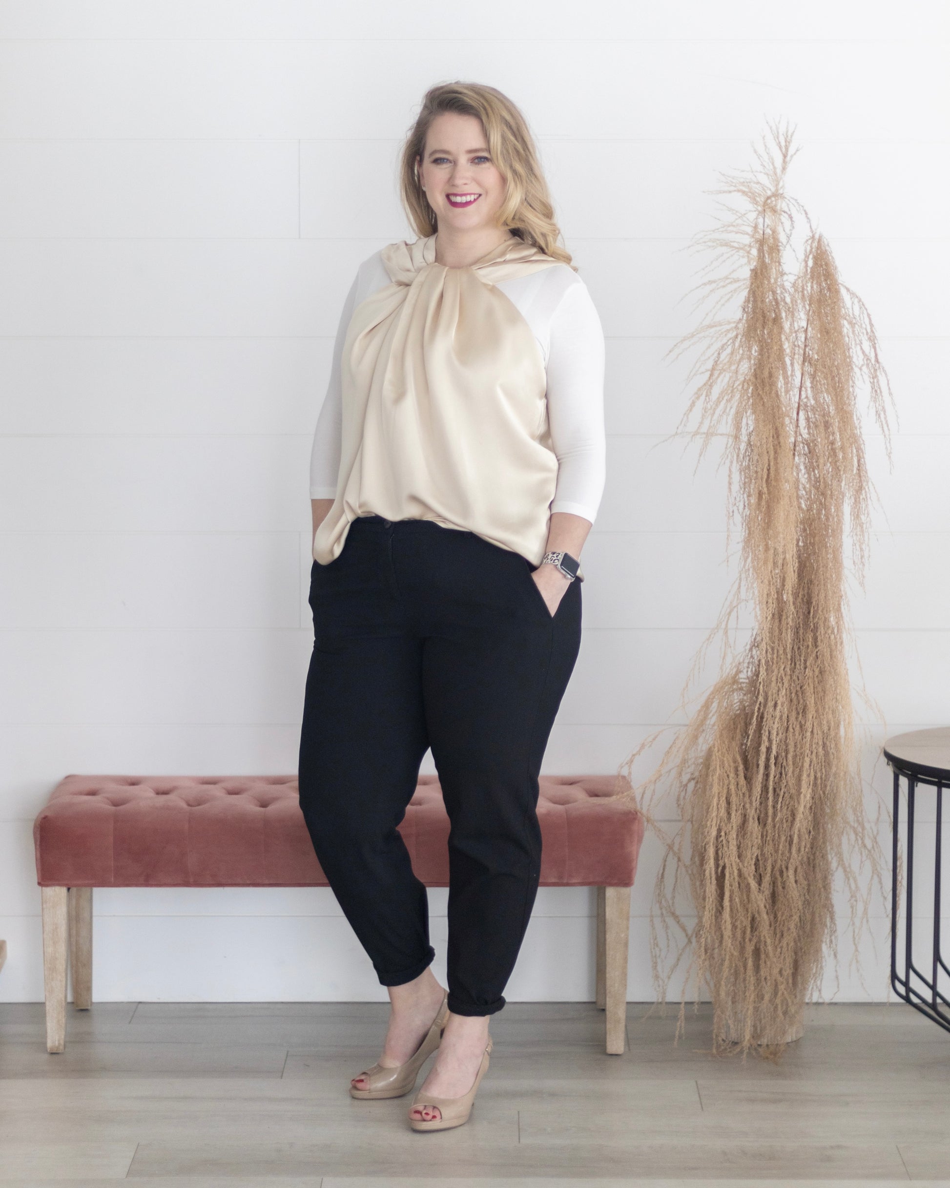 Woman in black pants and cream top, wearing The Classic 3/4 Sleeve Halftee - NEUTRALS.